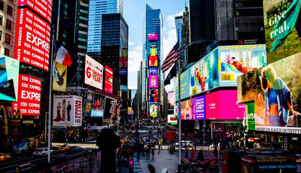 Which NYC spot blinds you with neon signs and frantic tourist energy?