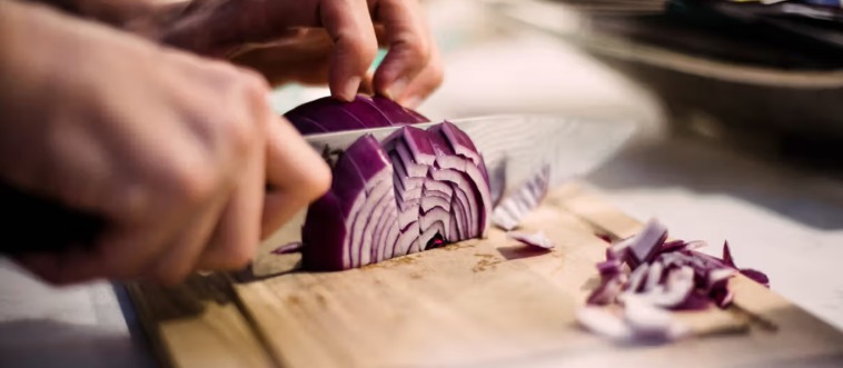 Which kitchen veggie fights back by making you weep as you slice it?